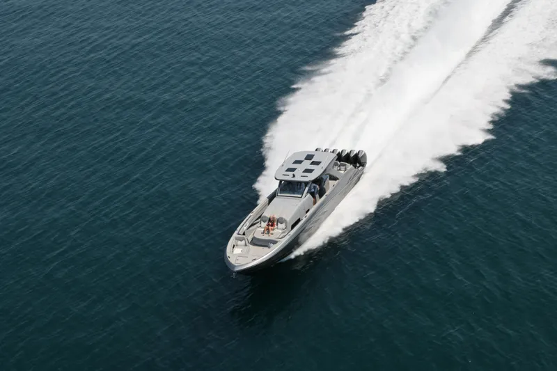 Slide: The Image of Aerial view of 2026 Deep Impact 499 Sport boat speeding on open water. - 5