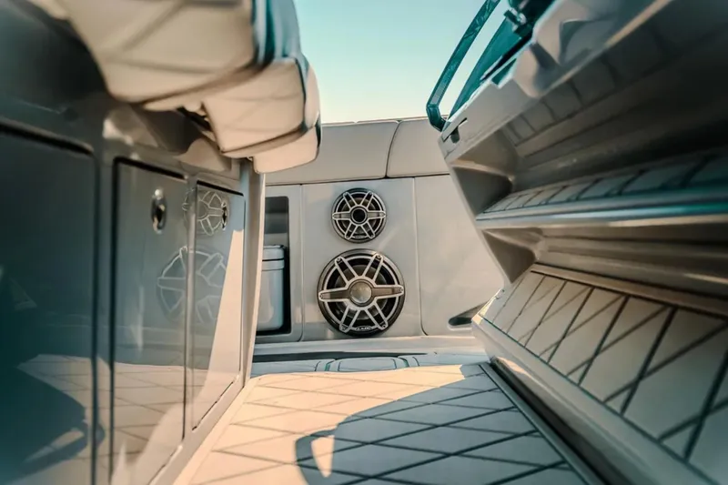 Slide: The Image of Interior view of 2026 Deep Impact 499 Sport boat, featuring sleek design and modern speakers. - 51