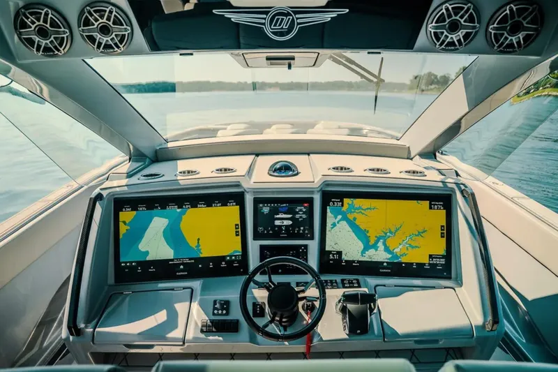 Slide: The Image of Cockpit of 2026 Deep Impact 499 Sport boat with advanced navigation displays. - 54