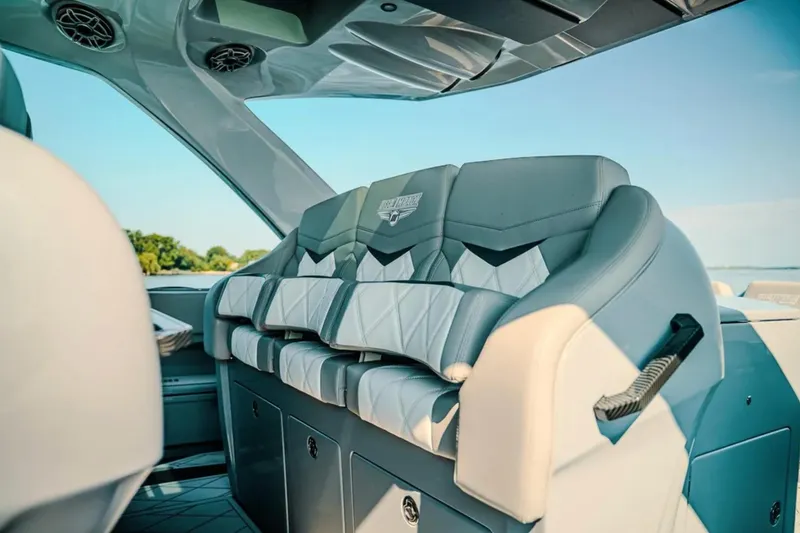 Slide: The Image of Luxurious seating on 2026 Deep Impact 499 Sport boat, featuring modern design and comfort. - 56