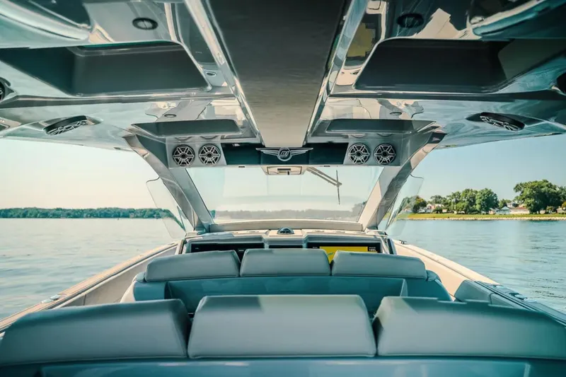 Slide: The Image of Interior view of 2026 Deep Impact 499 Sport boat on a serene lake. - 58