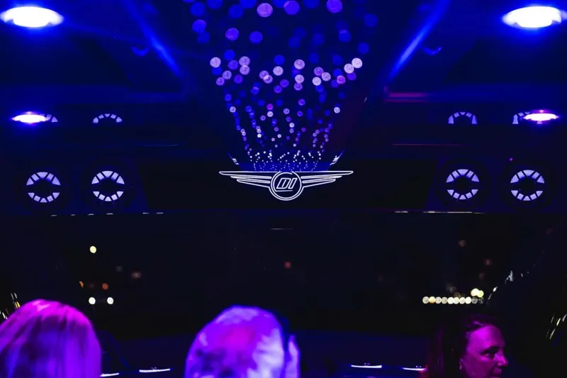 Slide: The Image of Interior of 2026 Deep Impact 499 Sport with ambient purple lighting and logo. - 59