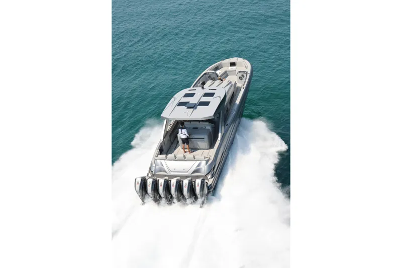 Slide: The Image of 2026 Deep Impact 499 Sport boat cruising on open water, showcasing powerful engines. - 6