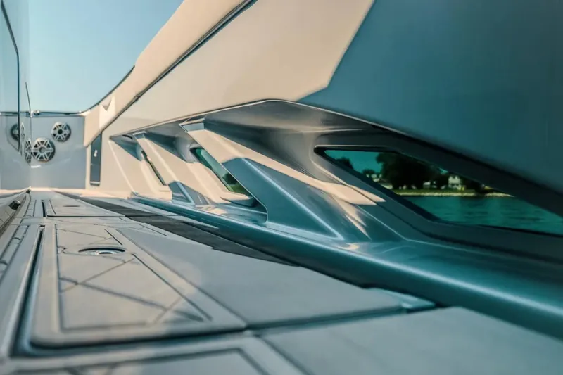 Slide: The Image of Sleek design of 2026 Deep Impact 499 Sport boat, showcasing modern architecture and water reflection. - 61