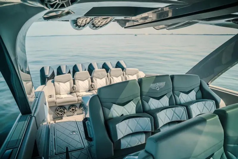 Slide: The Image of Luxurious interior of 2026 Deep Impact 499 Sport boat with plush seating and modern design. - 64