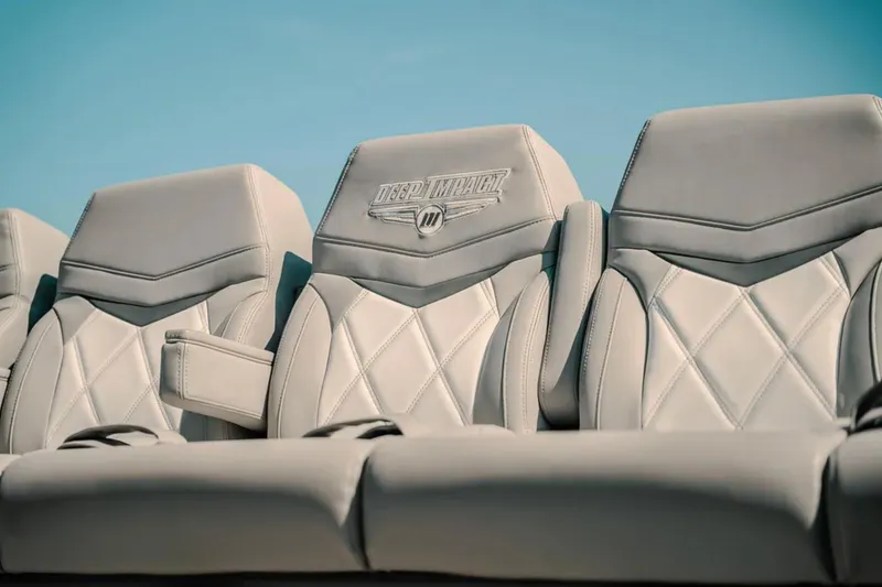 Slide: The Image of Luxurious leather seats of 2026 Deep Impact 499 Sport boat under clear sky. - 65