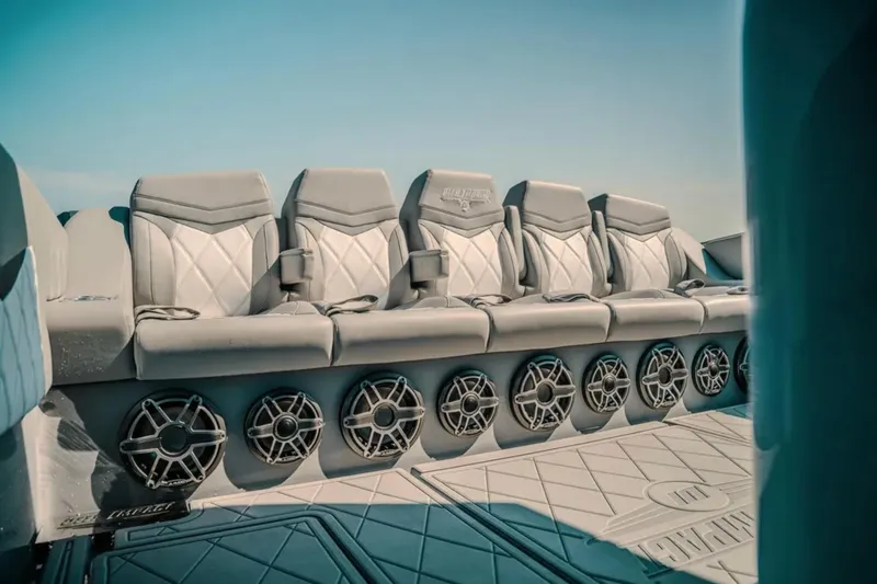 Slide: The Image of Luxury seating on 2026 Deep Impact 499 Sport boat with premium audio system. - 69