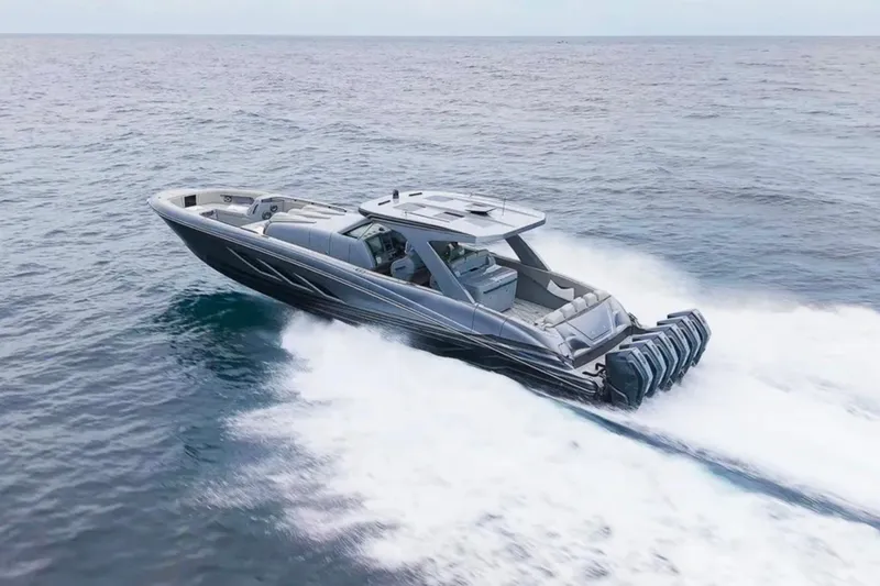 Slide: The Image of 2026 Deep Impact 499 Sport boat cruising swiftly on open water. - 9