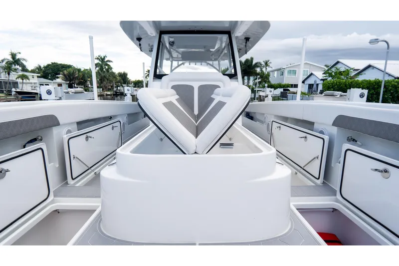Slide: The Image of 2025 Front Runner 43 Catamaran interior with open storage compartments and seating. - 24