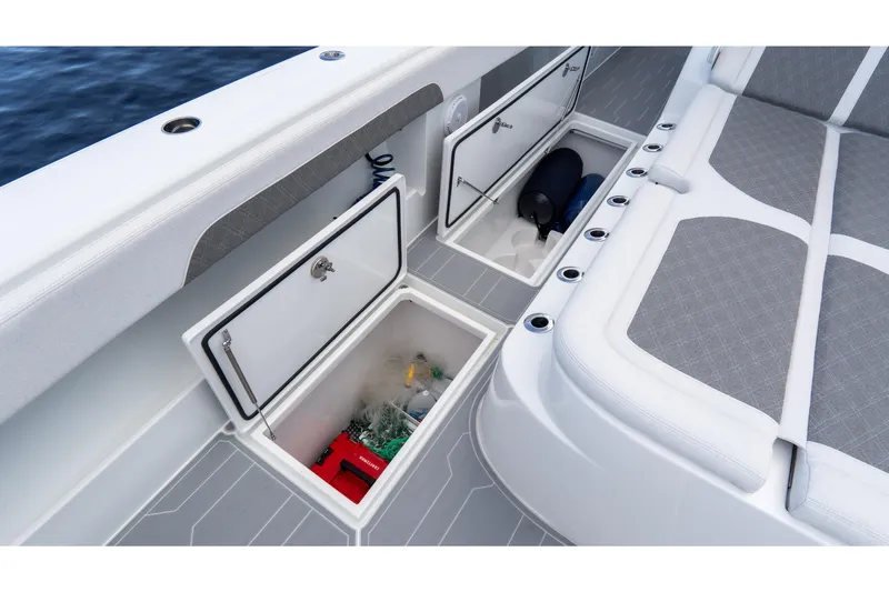 Slide: The Image of Storage compartments on 2025 Front Runner 43 Catamaran, featuring cushioned seating and ocean backdrop. - 28