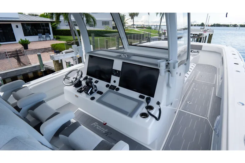 Slide: The Image of 2025 Front Runner 43 Catamaran helm with modern controls and dual screens. - 34