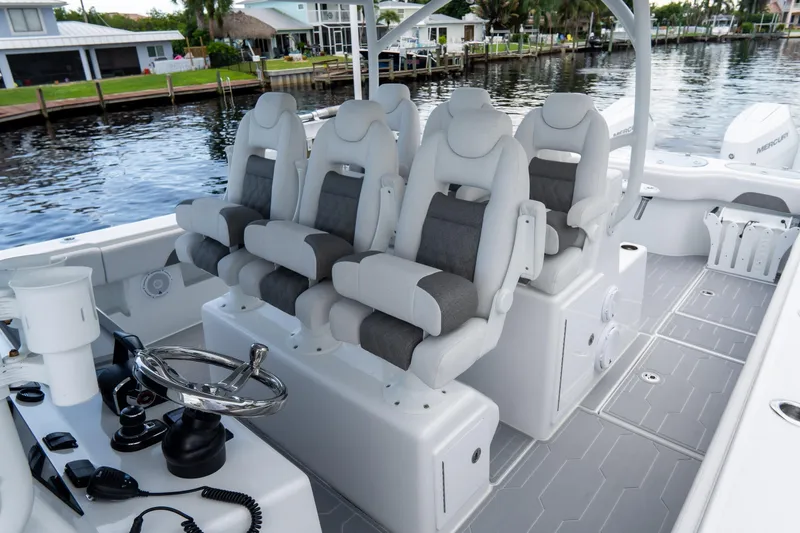 Slide: The Image of Luxury seating on 2025 Front Runner 43 Catamaran, featuring modern helm and waterfront view. - 47