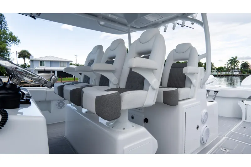 Slide: The Image of Luxury seating on 2025 Front Runner 43 Catamaran, featuring plush white and gray seats. - 49