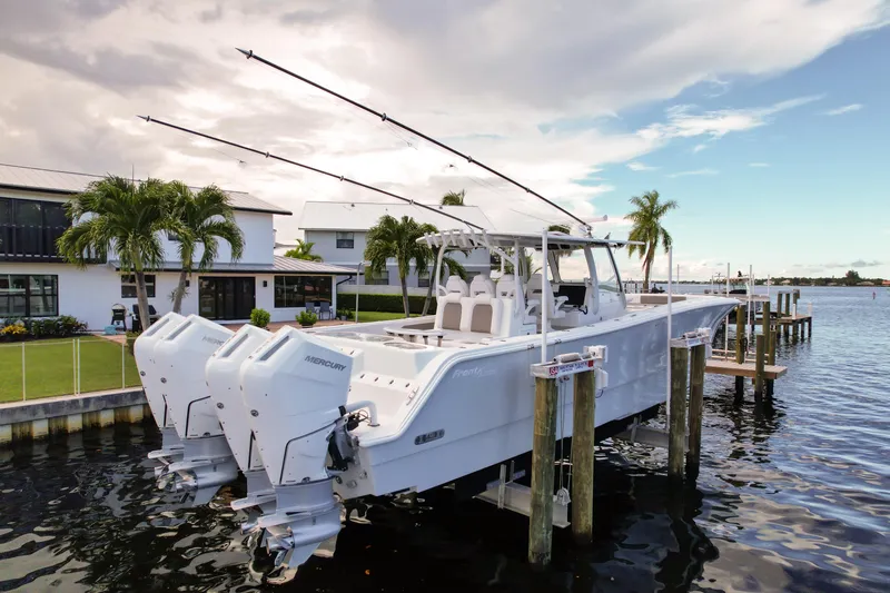 Slide: The Image of 2025 Front Runner 43 Catamaran docked, featuring triple Mercury outboard engines. - 5