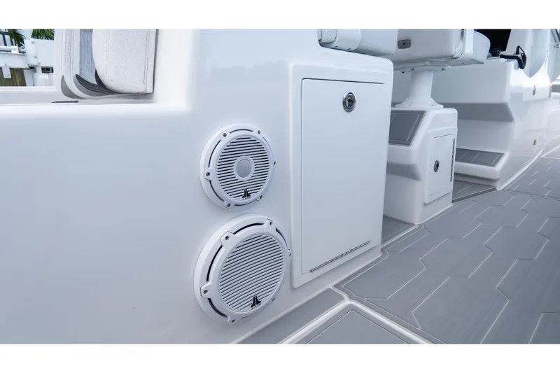 Slide: The Image of 2025 Front Runner 43 Catamaran interior with speakers and storage compartments. - 55