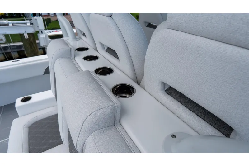 Slide: The Image of Luxury seating with cup holders on 2025 Front Runner 43 Catamaran. - 64