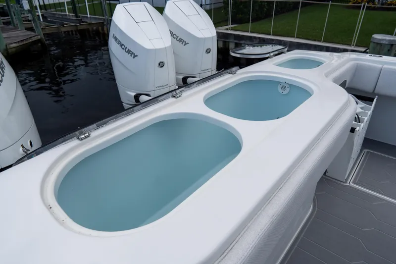 Slide: The Image of 2025 Front Runner 43 Catamaran with Mercury engines and livewell compartments. - 67