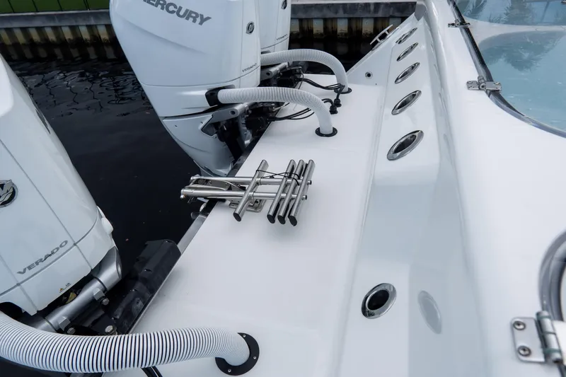 Slide: The Image of 2025 Front Runner 43 Catamaran with Mercury Verado engines, docked, showcasing deck and fittings. - 70