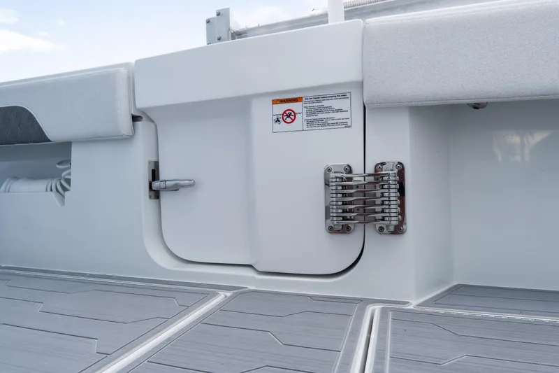 Slide: The Image of 2025 Front Runner 43 Catamaran deck detail with safety warning and sleek design. - 76