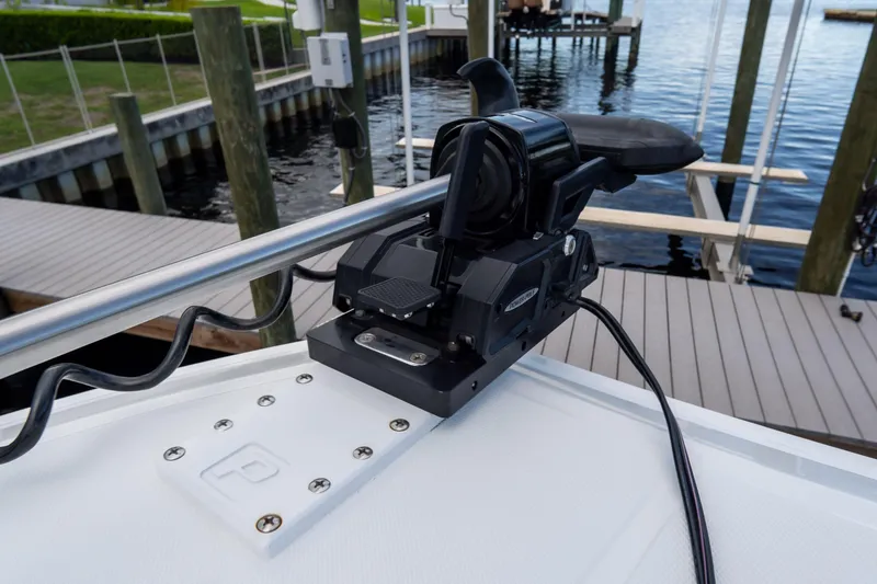 Slide: The Image of Close-up of a 2025 Front Runner 43 Catamaran's motor mount at a dock. - 79