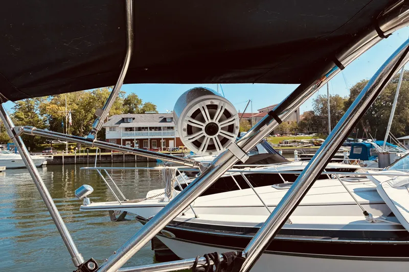 Slide: The Image of 2005 Hunter 33 sailboat docked at marina with scenic waterfront view. - 10