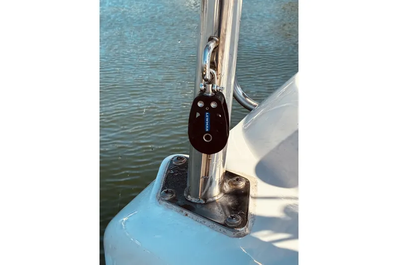 Slide: The Image of Key fob hanging on a Hunter 33 sailboat, 2005 model, near water. - 13