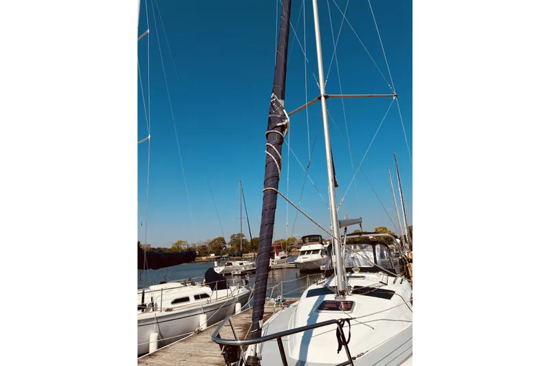 Slide: The Image of Sailboat docked at marina, Hunter 33 model, 2005, under clear blue sky. - 24