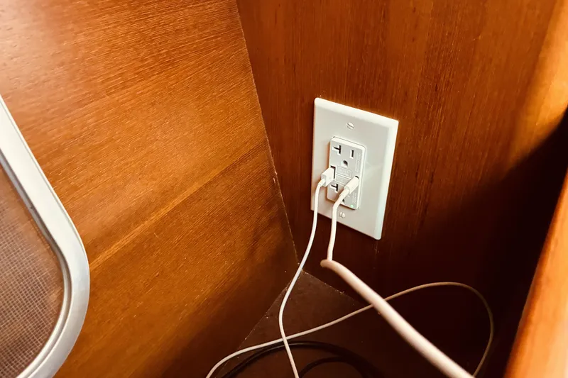 Slide: The Image of Power outlet with cables in 2005 Hunter 33 boat interior. - 34
