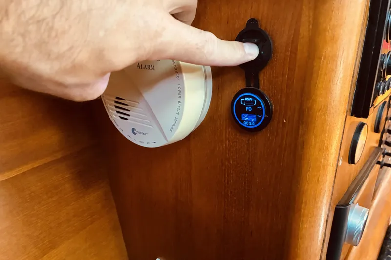 Slide: The Image of Hand operating control panel on 2005 Hunter 33 boat interior. - 35