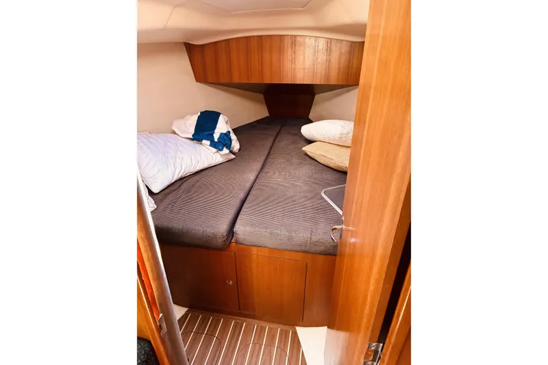 Slide: The Image of Cozy cabin interior of 2005 Hunter 33 sailboat with comfortable bedding. - 36