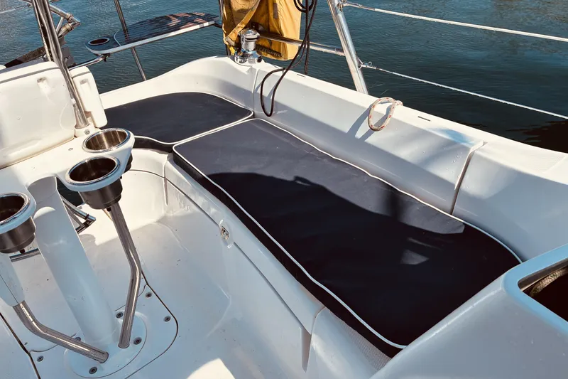 Slide: The Image of Cockpit seating area on a 2005 Hunter 33 sailboat with cup holders. - 7
