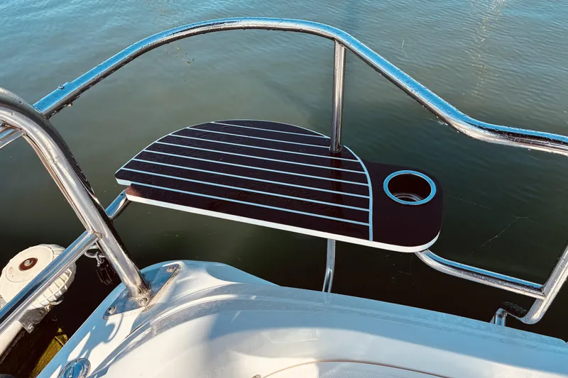 Slide: The Image of Stainless steel railing and deck on 2005 Hunter 33 boat, with cup holder. - 8