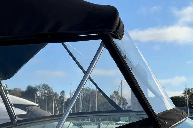 Slide: The Image of Close-up of 2004 Sea Ray 320 Sundancer boat canopy and windshield. - 15