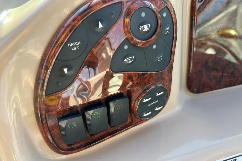Slide: The Image of Control panel of a 2004 Sea Ray 320 Sundancer boat with wood finish. - 38
