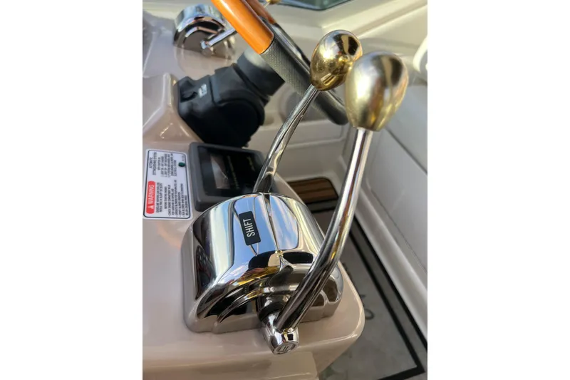Slide: The Image of Close-up of 2004 Sea Ray 320 Sundancer boat controls with shift levers. - 40