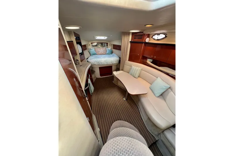 Slide: The Image of Luxurious interior of 2004 Sea Ray 320 Sundancer yacht with cozy seating and elegant decor. - 44