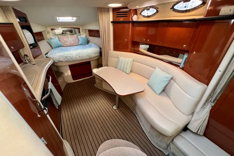 Slide: The Image of Luxurious interior of 2004 Sea Ray 320 Sundancer yacht with cozy seating and elegant wood finishes. - 45