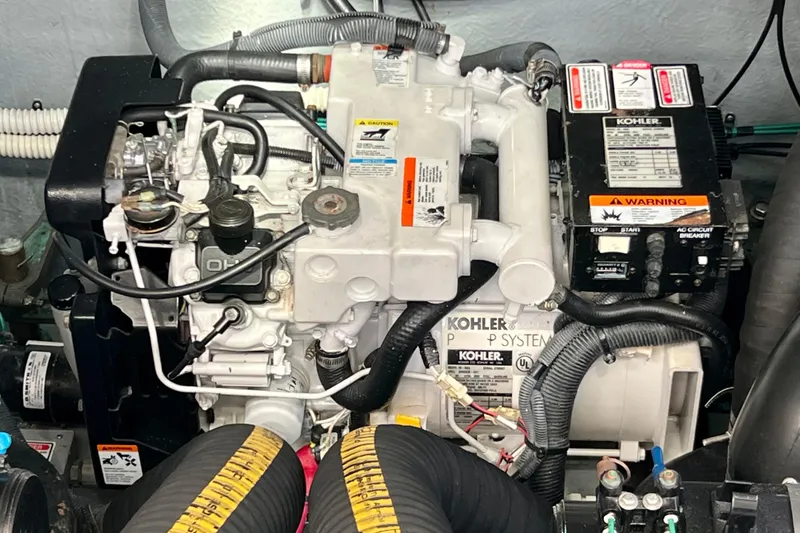 Slide: The Image of Engine compartment of a 2004 Sea Ray 320 Sundancer with Kohler generator system. - 67