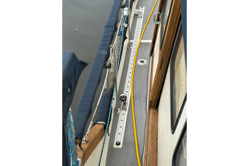 Slide: The Image of 1980 Nauticat Pilothouse deck with railing and equipment details. - 28