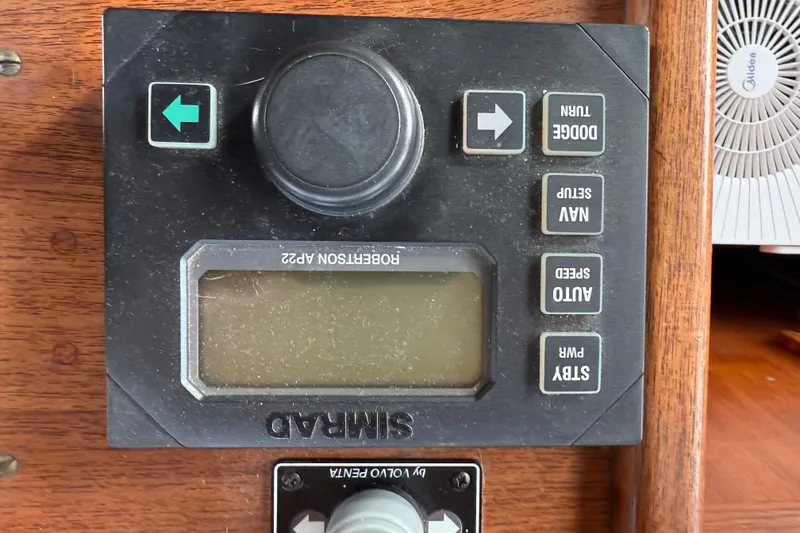Slide: The Image of Control panel of a 1980 Nauticat Pilothouse boat with navigation buttons. - 37