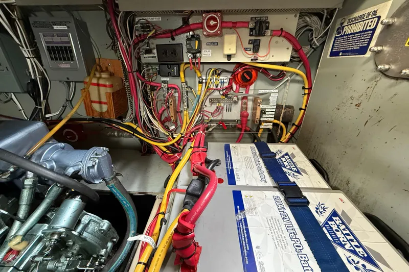 Slide: The Image of Electrical system and batteries in a 1980 Nauticat Pilothouse boat engine room. - 45