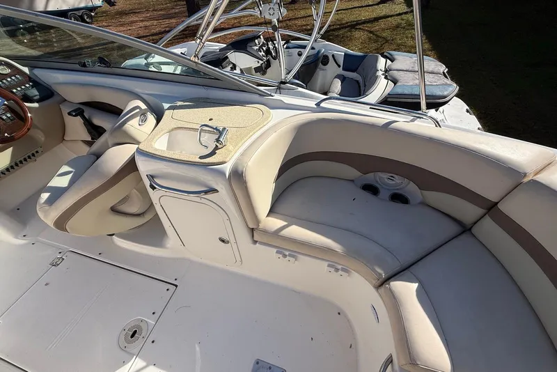 Slide: The Image of 2006 Chaparral 256 SSi boat interior with beige seating and steering area. - 4
