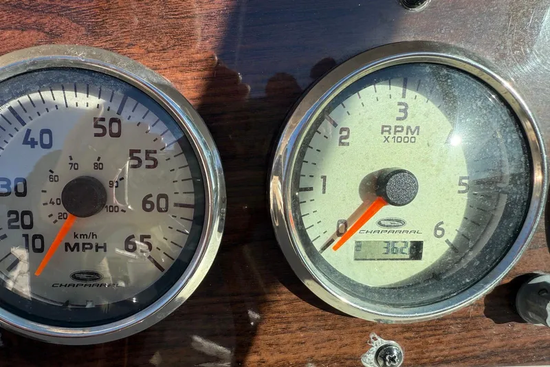 Slide: The Image of Speedometer and tachometer of 2006 Chaparral 256 SSi boat dashboard. - 7