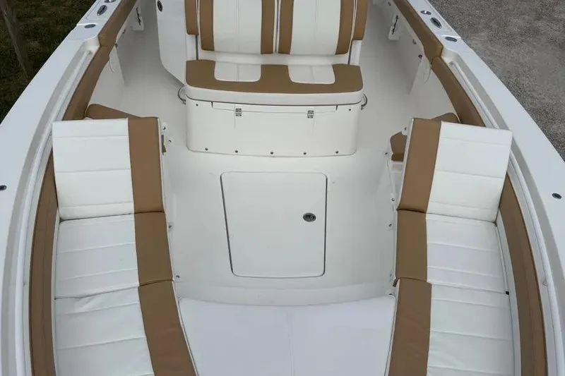 Slide: The Image of 2025 Regulator 26XO boat interior with white and tan seating arrangement. - 3