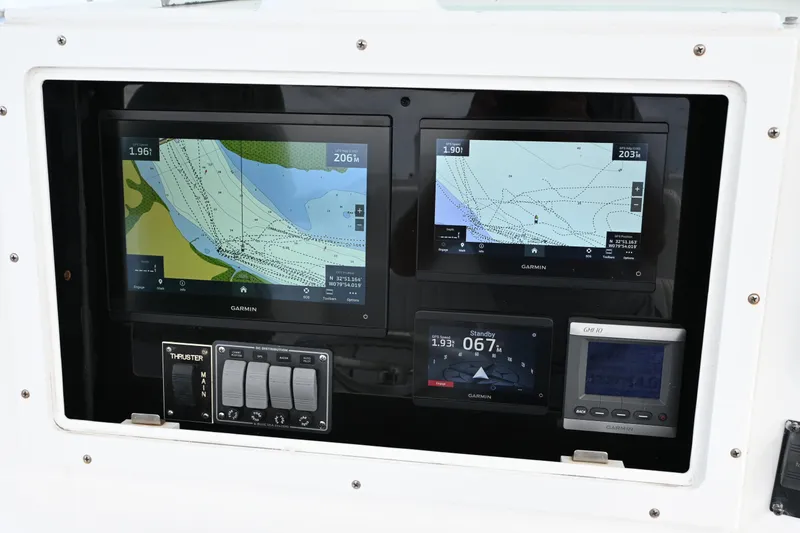 Slide: The Image of 2008 Regulator 32 Forward Seating boat with Garmin navigation displays and control panel. - 7