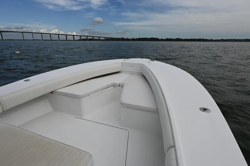 Slide: The Image of 2008 Regulator 32 Forward Seating boat on open water with bridge in background. - 8