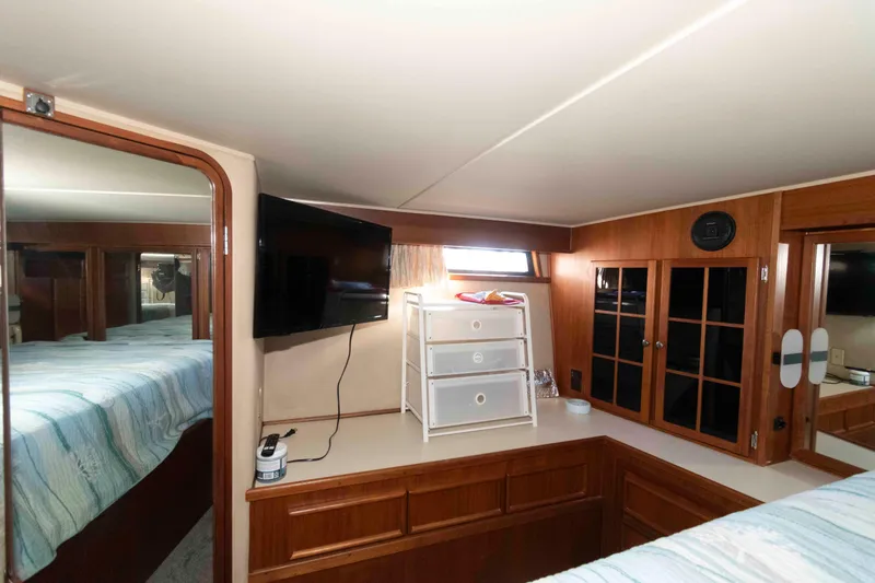Slide: The Image of Interior of 1988 Chris-Craft 46 Constellation yacht with wood cabinetry and modern amenities. - 22