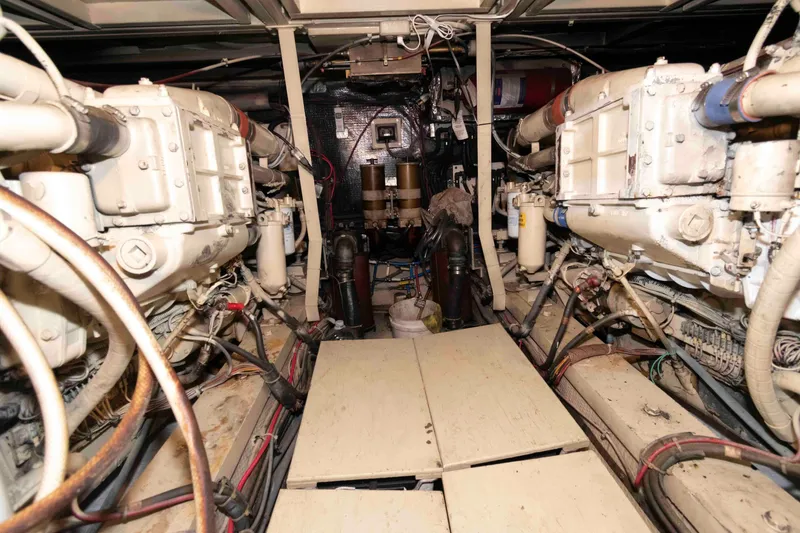 Slide: The Image of Engine room of 1988 Chris-Craft 46 Constellation yacht, showcasing dual engines and mechanical components. - 29