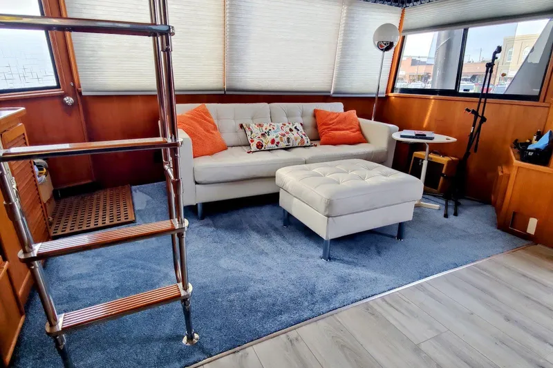 Slide: The Image of 1988 Chris-Craft 46 Constellation yacht docked at marina under clear blue sky. - 3