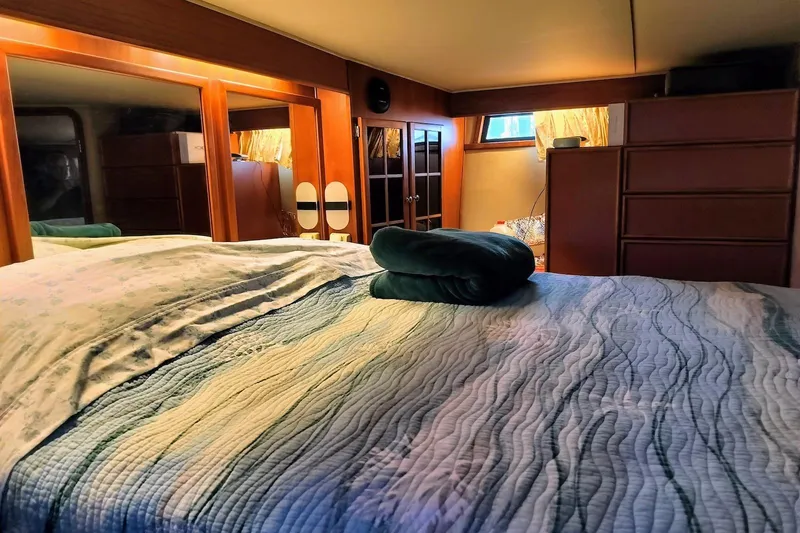 Slide: The Image of 1988 Chris-Craft 46 Constellation helm with gauges, steering wheel, and navigation equipment. - 7